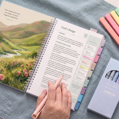 Her Year in the Bible open to Week 1, God's Image, with highlighters and pens